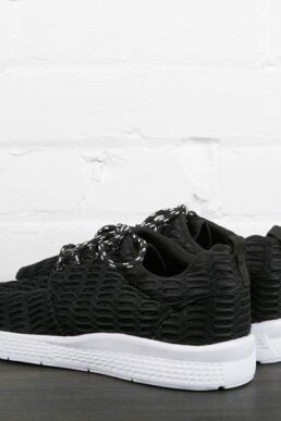 black sneakers with white sole