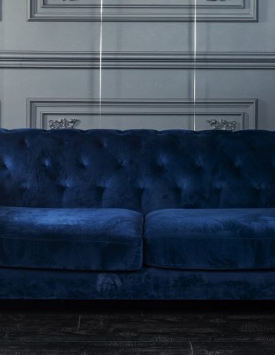 blue velvet couch with helium 2019 balloons