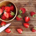 fresh strawberries being cut