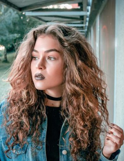 long curly hair and dark lipstick