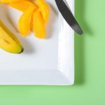 orange and banana on plate